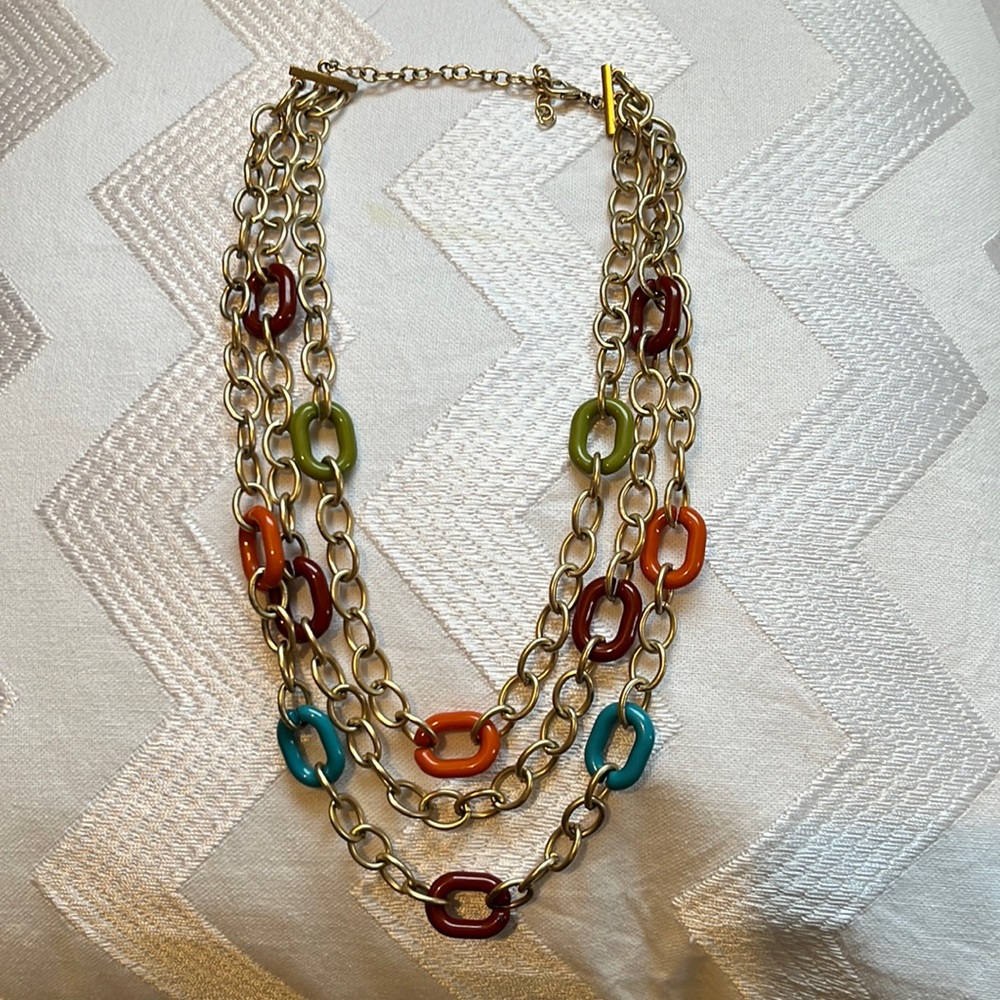 Layered chain link necklace with gold and jewel tone links